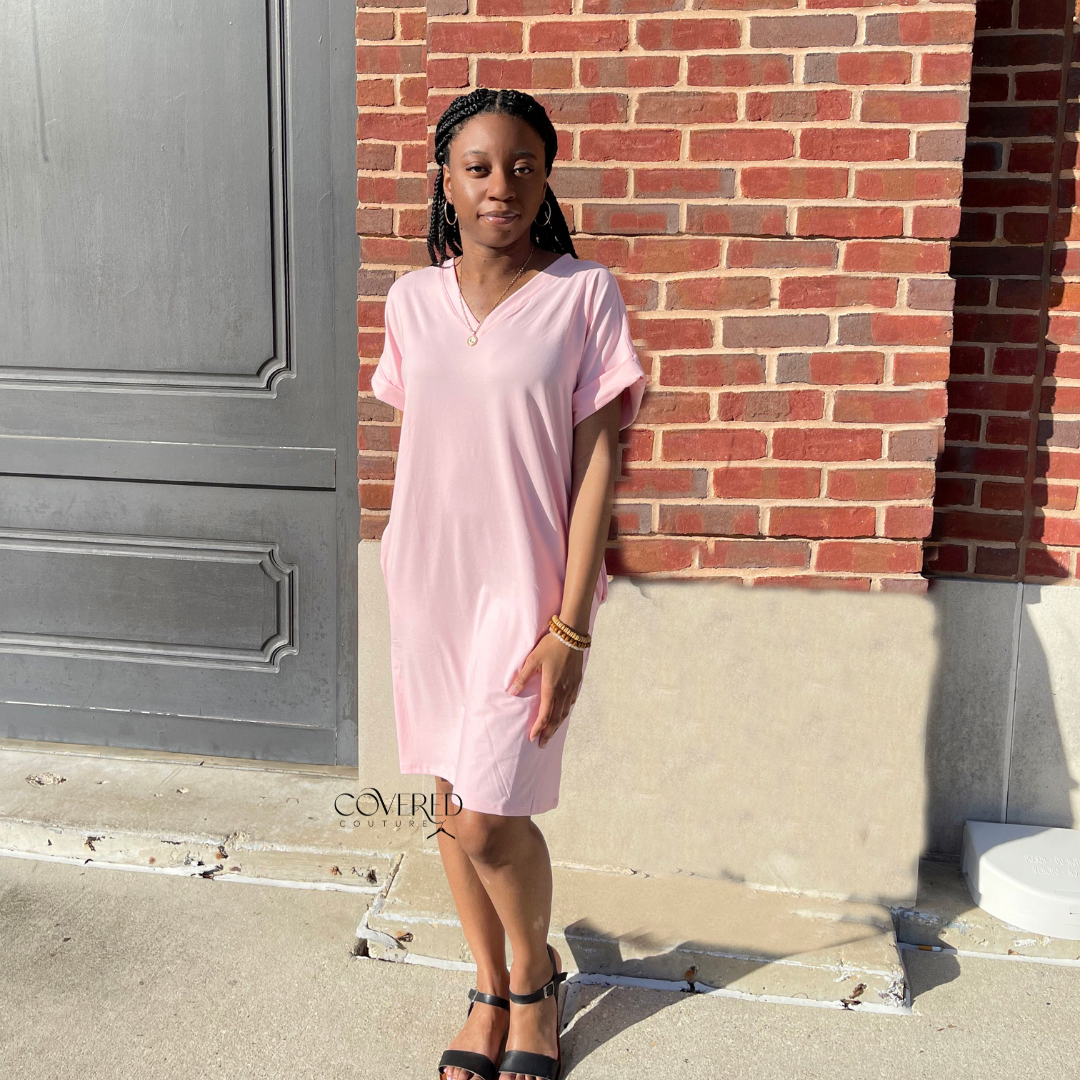 Light pink t-shirt dress paired with black sandals