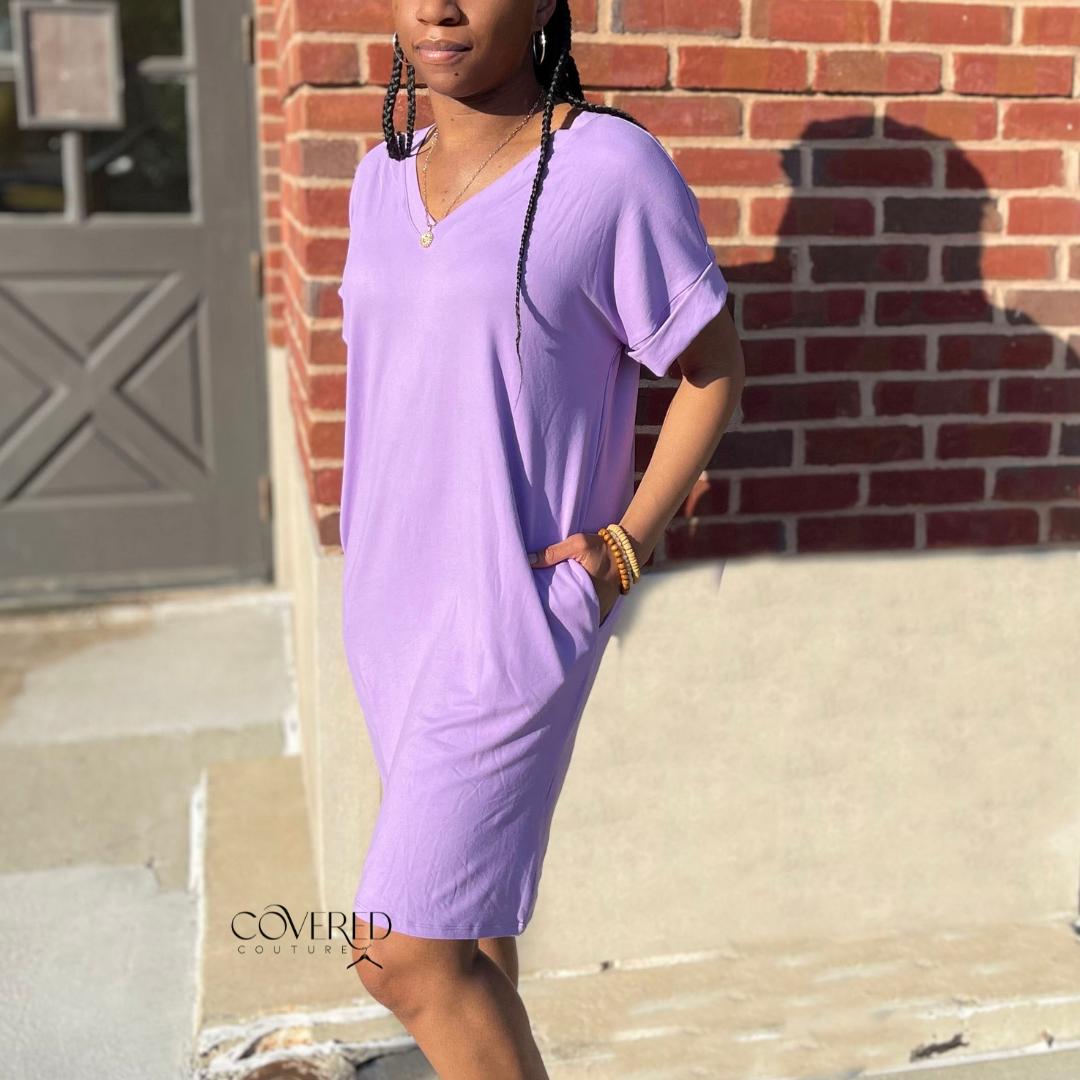 Lavender v-neck t-shirt dress with pockets paired with black sandals